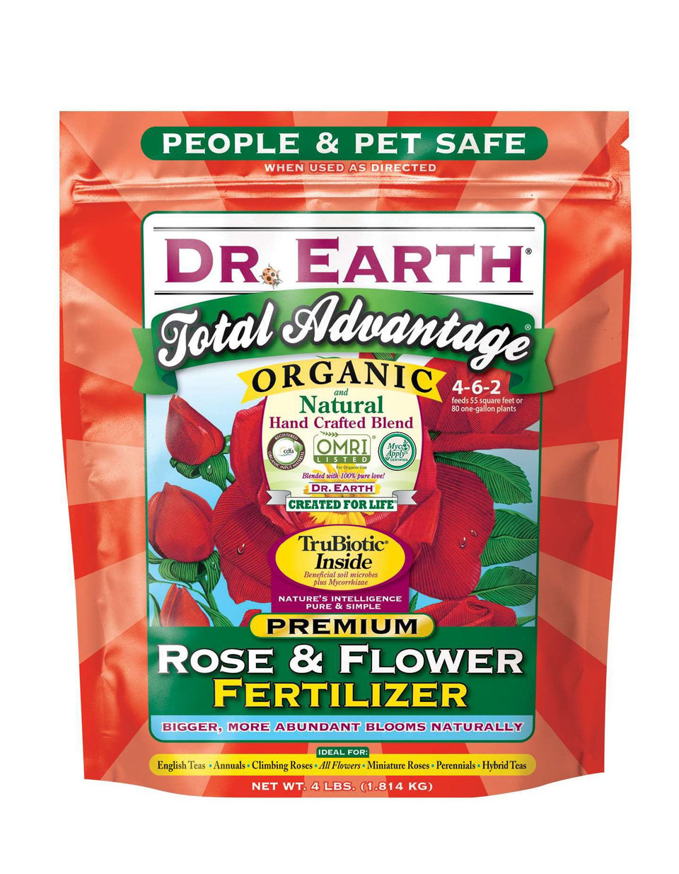 Dr. Earth Total Advantage Rose & Flower Fertilizer bottle boosts vibrant rose blooms in a home garden