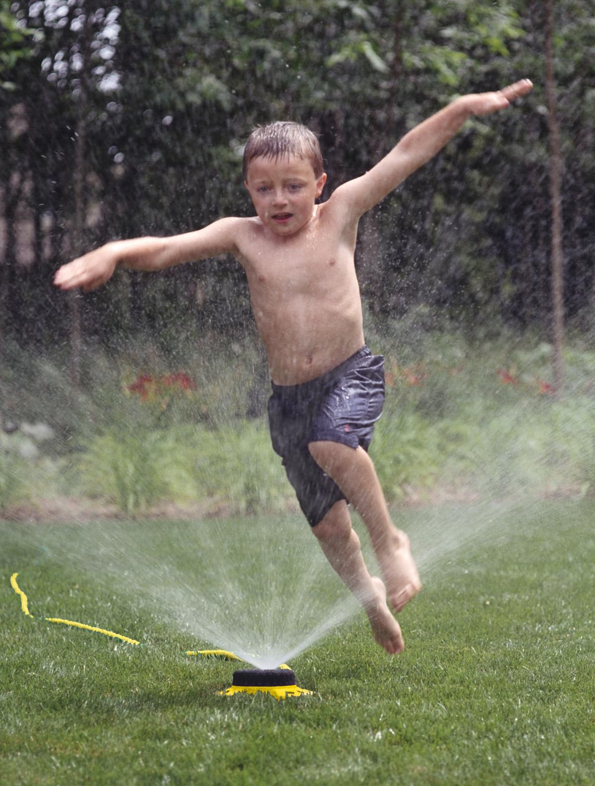 Dramm sprinkler with heavy-duty metal base for durable outdoor use.