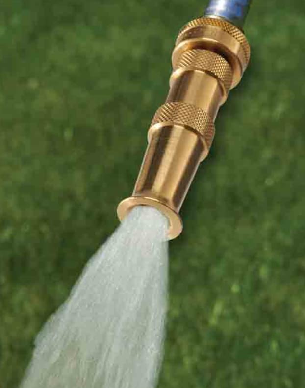 Close-up of precise jet stream from Dramm nozzle for targeted cleaning.