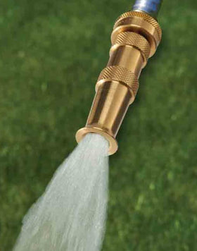 Close-up of precise jet stream from Dramm nozzle for targeted cleaning.