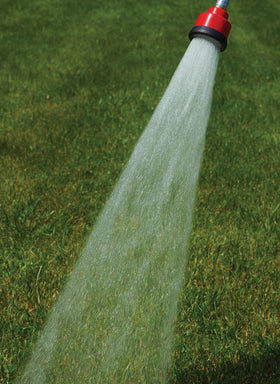 Dramm Water Breaker Nozzle in use around seedlings for gentle watering.