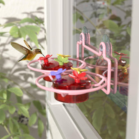 Two 2 ounce nectar containers with bee proof ports for hummingbirds