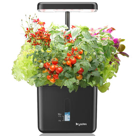 DRYADES Indoor Garden Self-Watering System showing a compact indoor planter setup for herbs