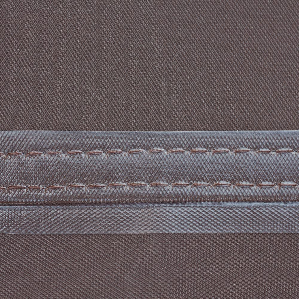 Duck Covers grill cover in mocha cappuccino color adds warm patio look.
