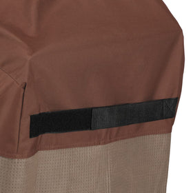 Duck Covers grill cover shows taped seams for leak protection.