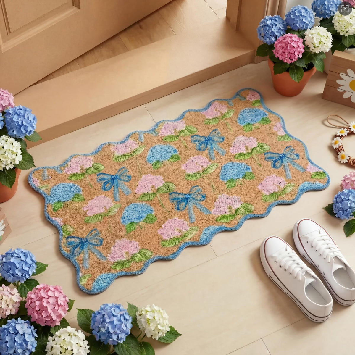 Dunzy Hydrangea Doormat with blue scalloped bow greets guests at the door.