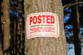 Dxyizus Signs 4-pack ready for multiple outdoor placements along property lines.