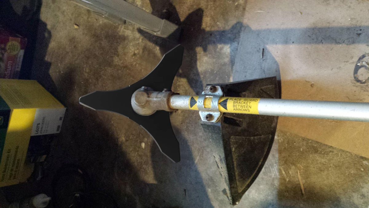 Eapele blade demonstrates safety gear and proper use during trimming.