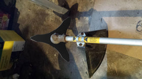 Eapele blade demonstrates safety gear and proper use during trimming.