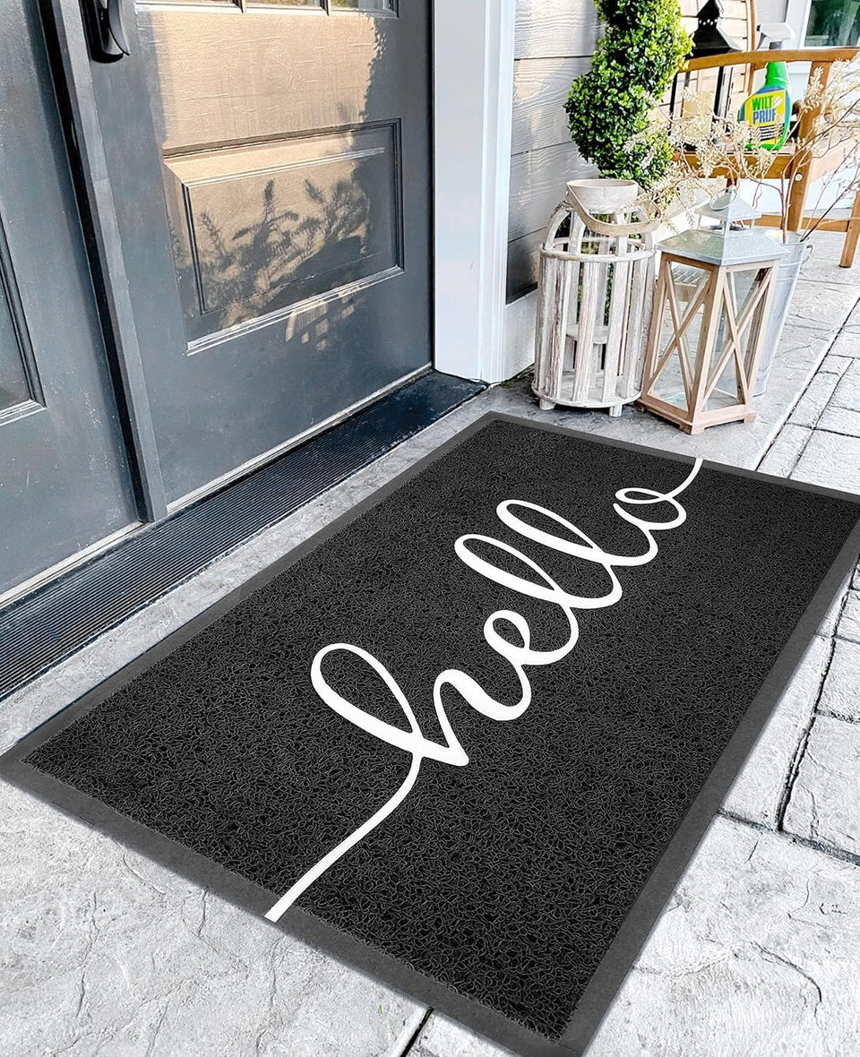 Earthall Funny Hello mat for outdoor entrance traps dirt and welcomes guests.