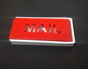 Earthtec mailbox flag with white mount blends with light exteriors.