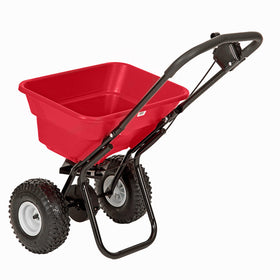 EarthWay 2050P spreader in action across a lawn