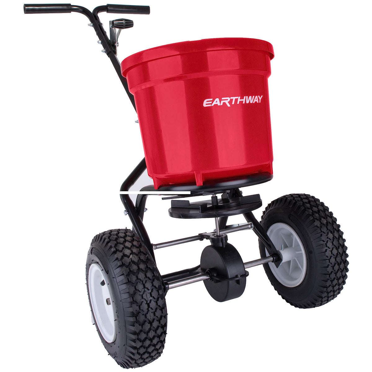 EarthWay 2150 spreader on turf with tires gliding over uneven ground for precise application