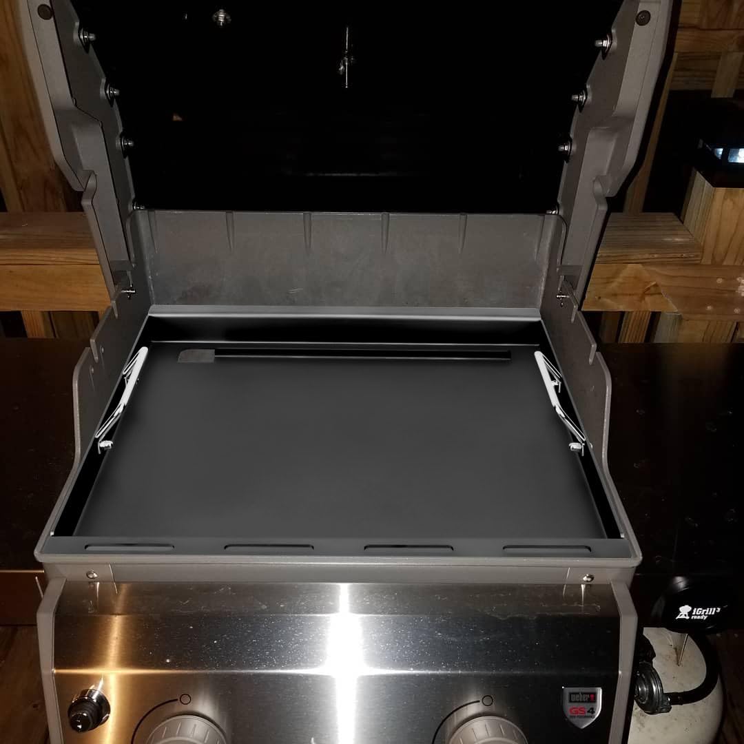 Large cooking area of EasiBBQ griddle plate ready for steaks and vegetables