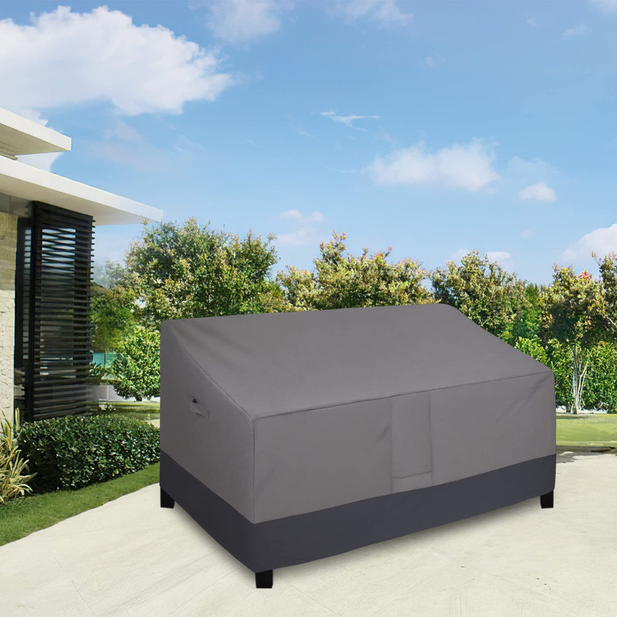 Easy-Going outdoor sofa cover side view with strap fasteners for windproof fit.