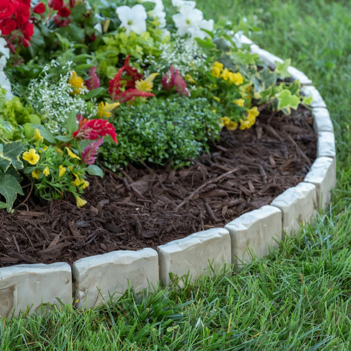 EasyFlex border installed over landscape fabric helps prevent weeds.