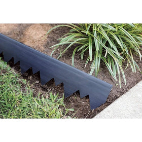EasyFlex installation in rocky soil with a hammer demonstrates quick edging setup.