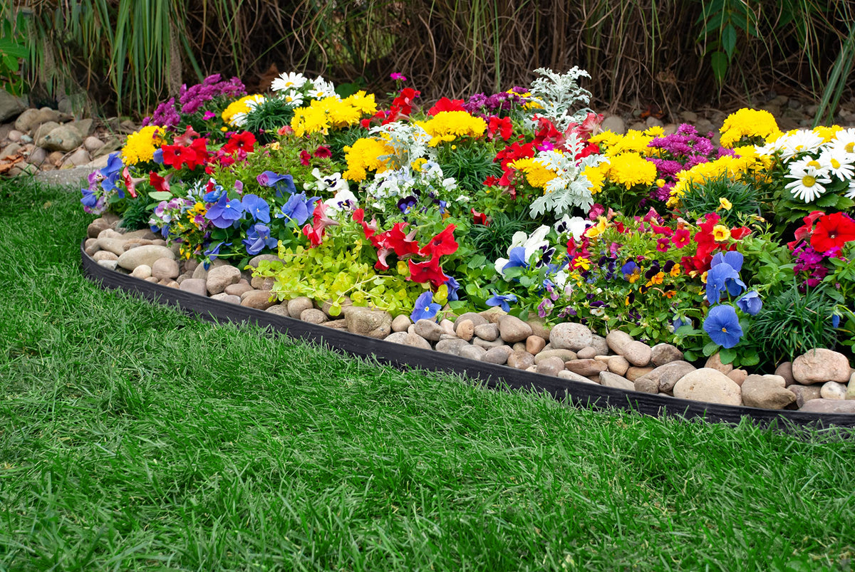 EasyFlex Tall Wall edging curves smoothly around a tree for defined landscaping.