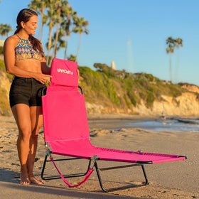 EASYGO PRODUCTS pink lawn chair at the beach for sun and relaxation