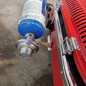 Regulator installed on a Coleman Roadtrip grill during setup