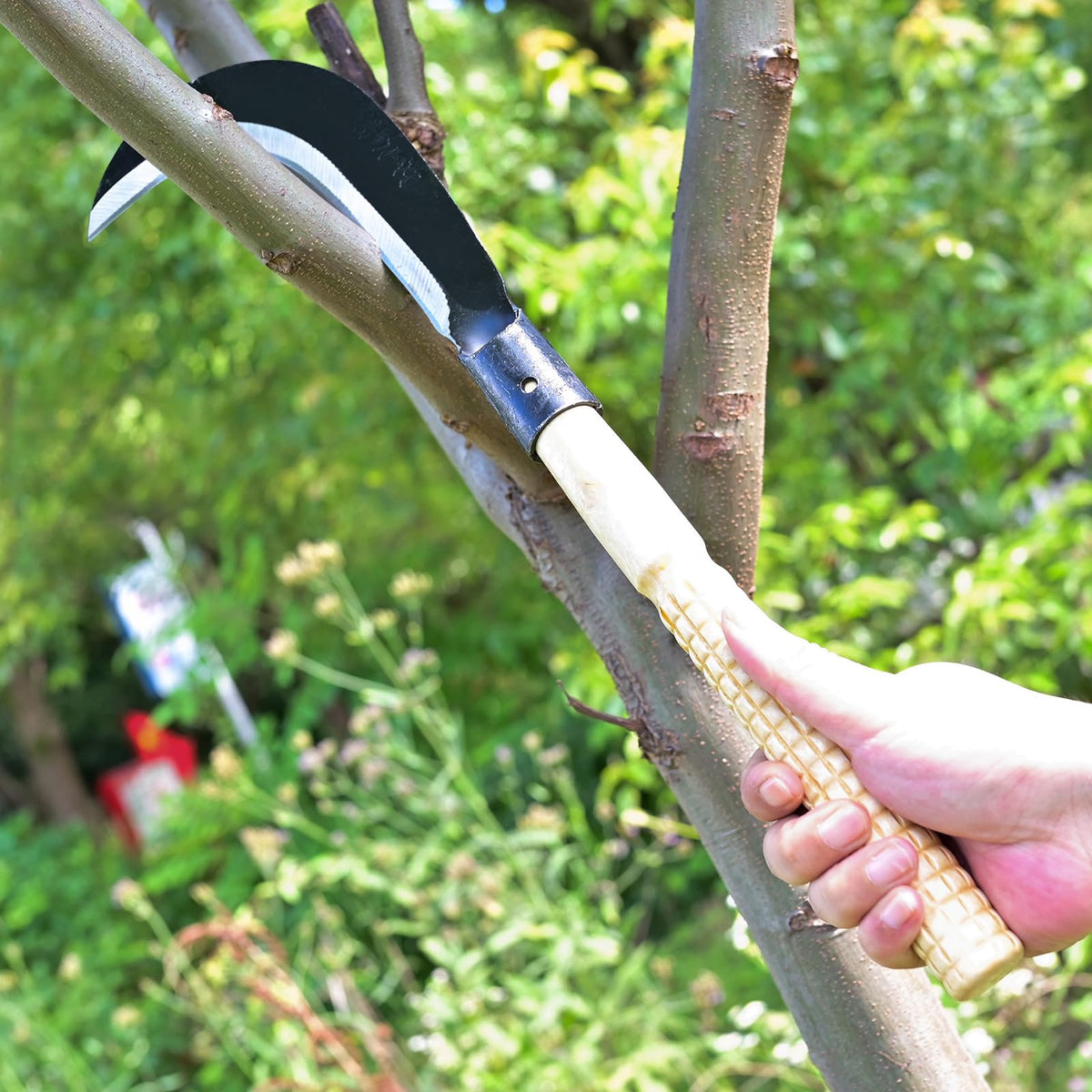 EcoDigiLife Billhook Sickle in use for garden cleanup