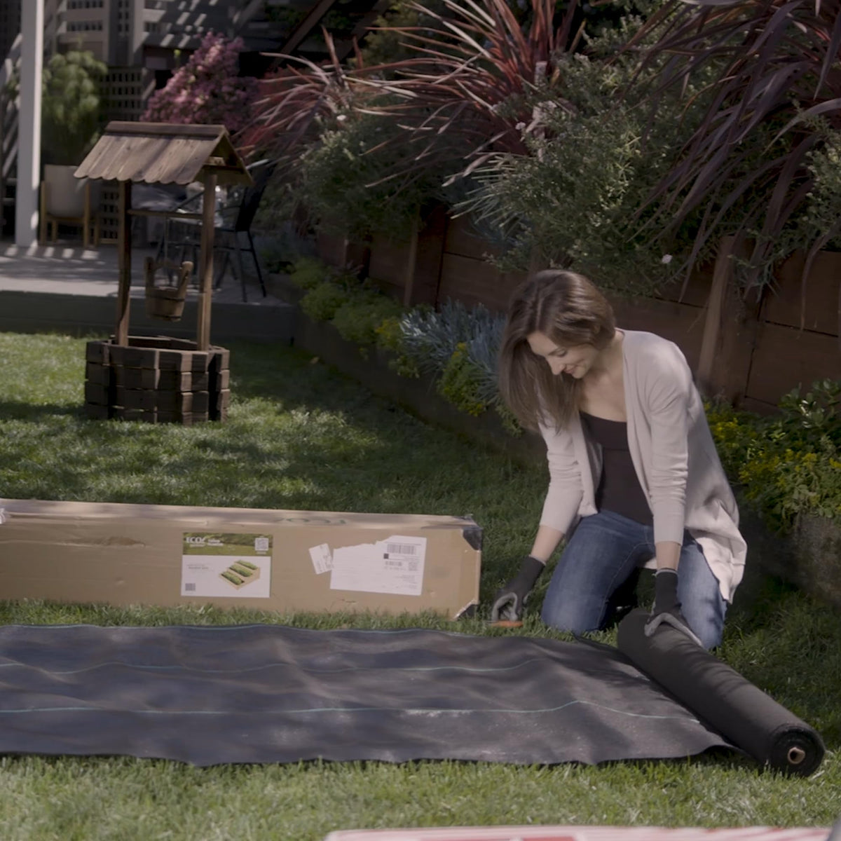 Heavy-duty ECOgardener weed barrier resists tearing during garden use.