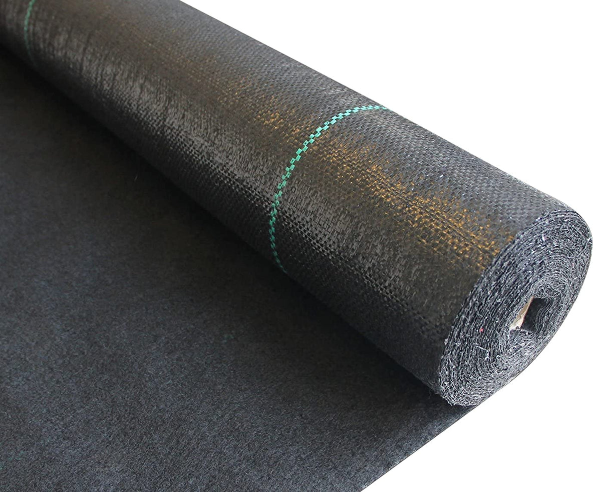 ECOgardener landscape fabric unrolled on soil to block weeds effectively.
