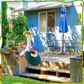 EKOREST gardener with flower pot and shovel accessory brightens garden decor.