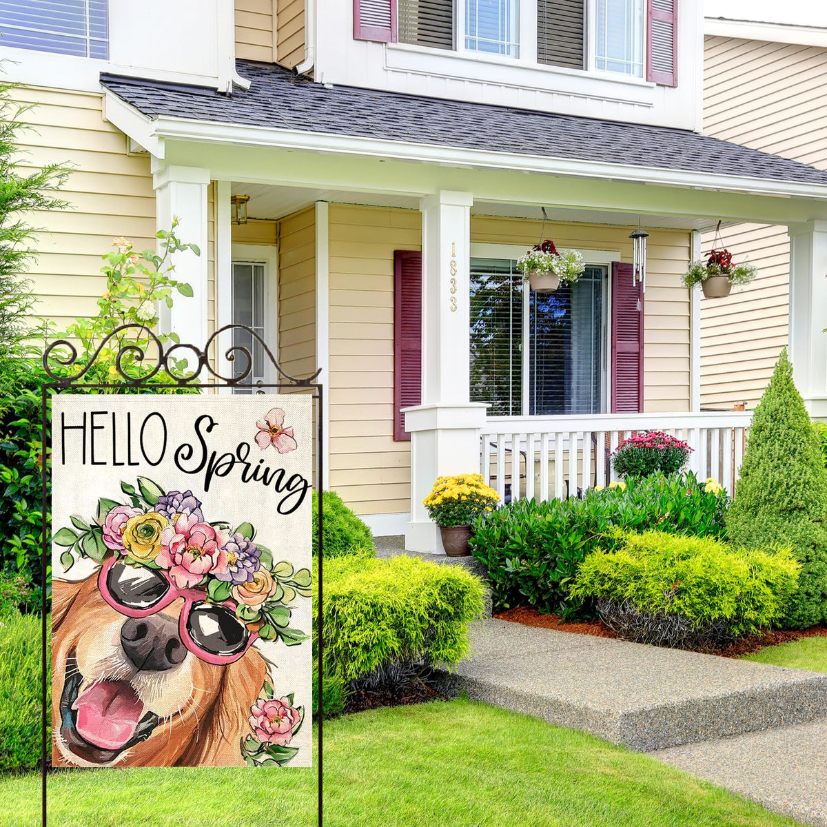EKOREST Hello Spring flag brightens a porch with vivid seasonal colors.