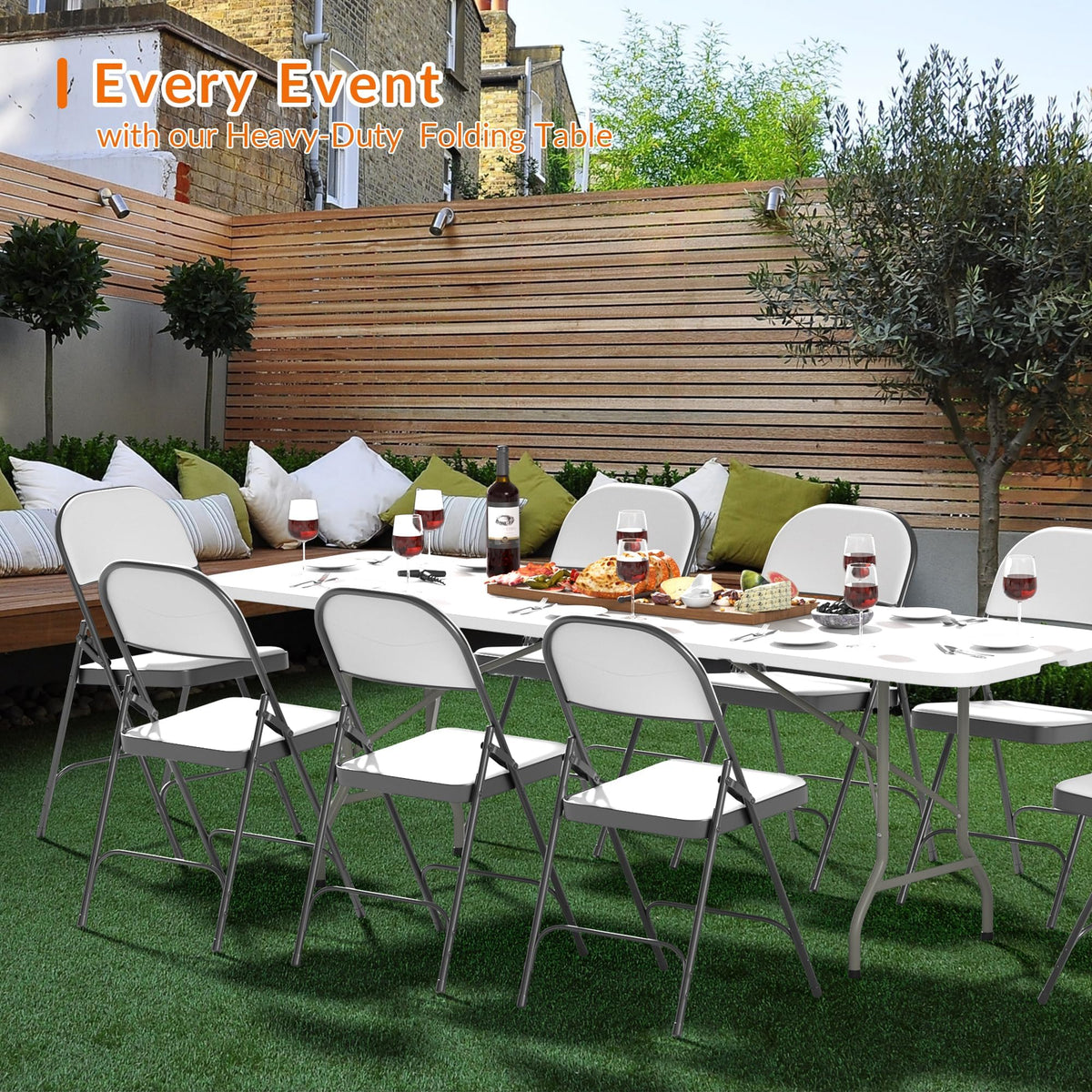 Elevon outdoor dining table in use at backyard gathering.
