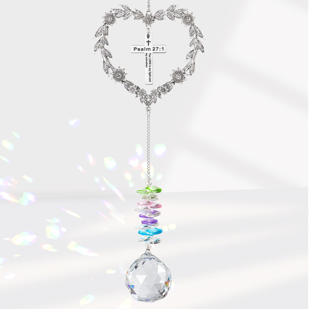 Elivida heart-shaped suncatcher cross front glowing in sunlight for daily faith reminder.