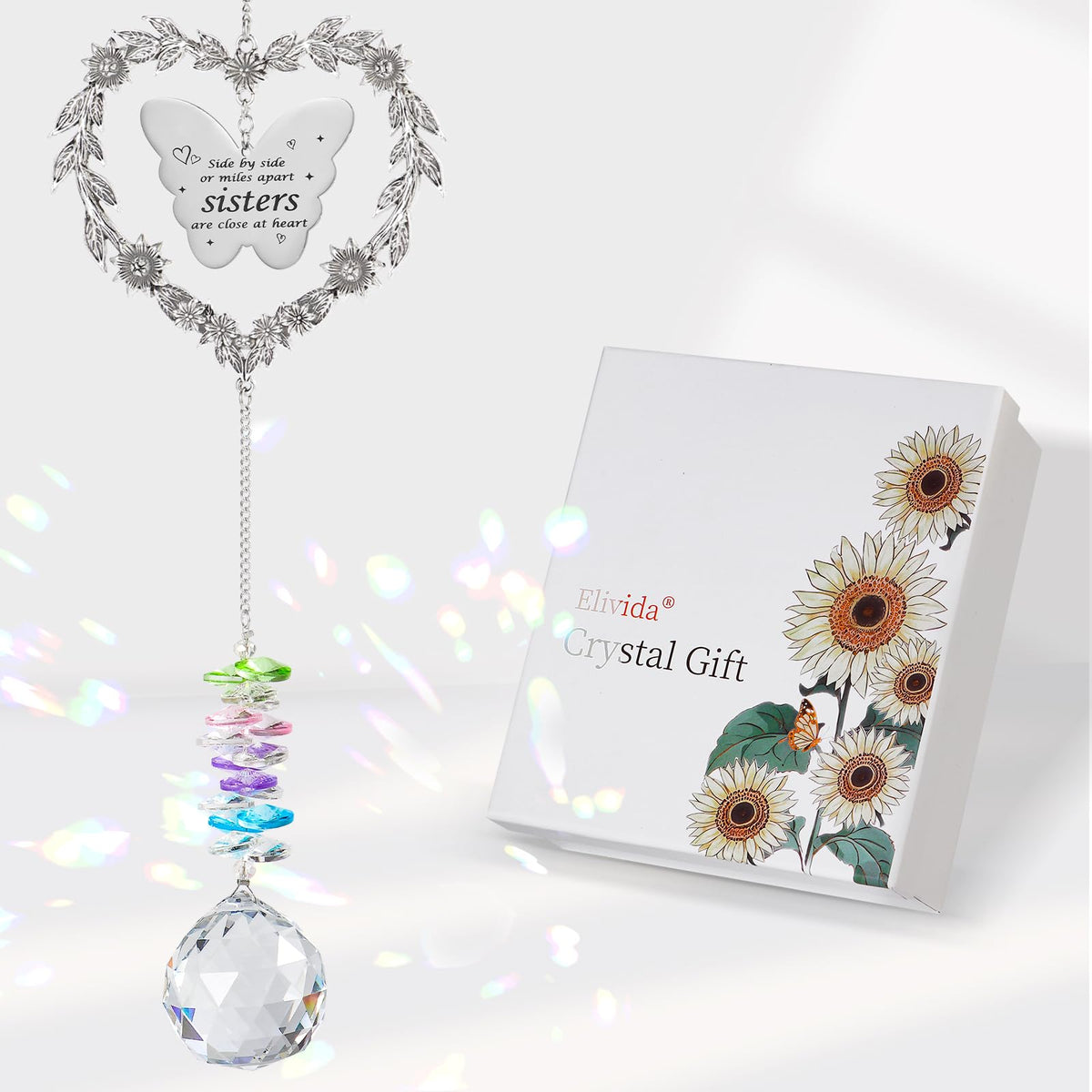 Elivida suncatcher heart wreath casting rainbow glow on indoor window