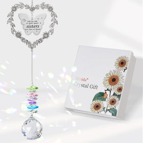 Elivida suncatcher heart wreath casting rainbow glow on indoor window