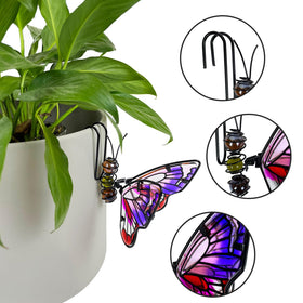 EMINGSKY iron-and-glass butterfly with hand-painted details catches sunlight.
