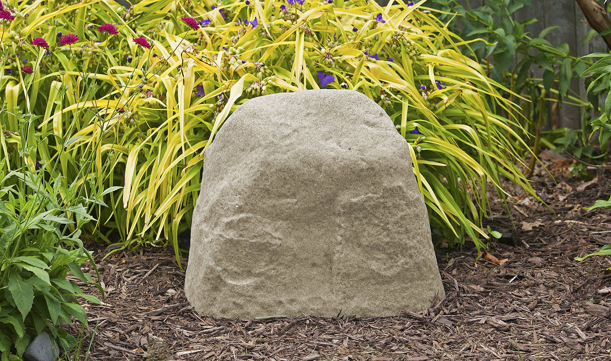 EMSCO Group 2182 Medium rock placed over a well cover conceals utilities.