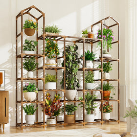 EnHomee tall plant stand with wooden shelves for indoor display.
