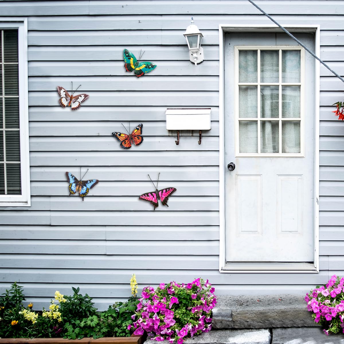 EOORAU 5-piece lifelike butterfly wall art for indoor or outdoor use.