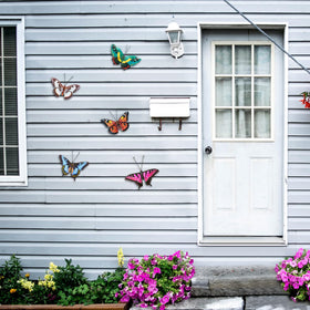 EOORAU 5-piece lifelike butterfly wall art for indoor or outdoor use.