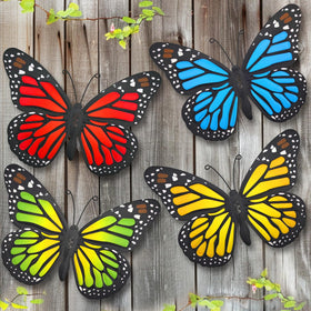 EOORAU metal butterfly wall art in blue adds charm to outdoor spaces