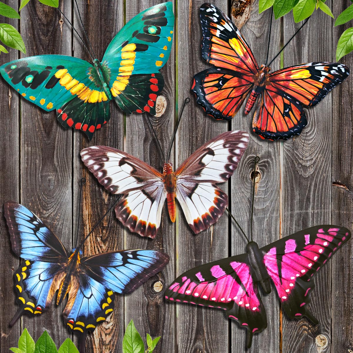 EOORAU metal butterfly wall decor perched on a fence with vibrant colors.