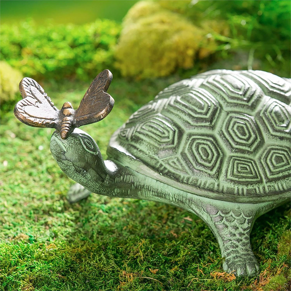 Evergreen Garden verdigris turtle-butterfly statue stands up to outdoor weather.