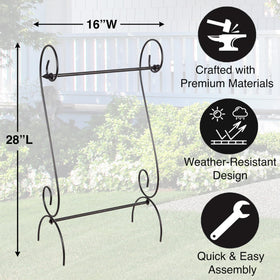 Evergreen Scroll Garden Flag Stand on patio with seasonal flag