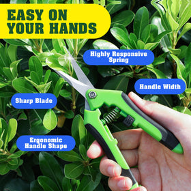 EWPJDK garden shears in action trimming a branch with a clean, controlled cut.