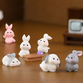 Exasinine resin bunny figurines adding whimsy to compact shelf displays