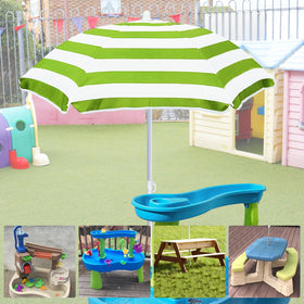 Exokugo kids umbrella covers a sand table at the beach for comfort