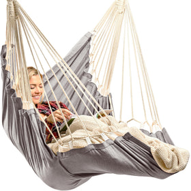 EXTIRIO hanging hammock chair with footrest offers full-body comfort indoors or outdoors.