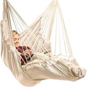 EXTIRIO Indoor Hanging Chair in a cozy bedroom provides full-body comfort.