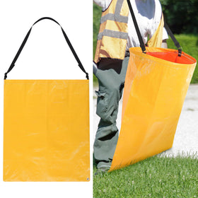Faccito litter bag with shoulder strap in use for easy outdoor cleanup.