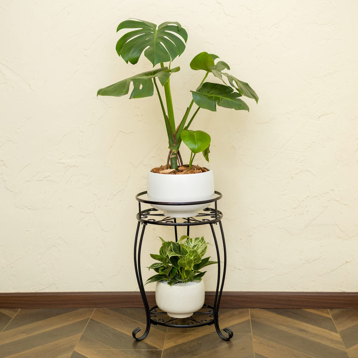 FaithLand indoor-outdoor use plant stand in black complements any decor.