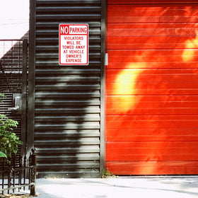 Faittoo No Parking Sign with six predrilled holes for easy mounting.